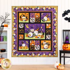 a halloween themed quilt hanging on the wall