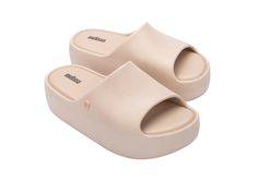 Part of the popular Free Collection, the Free Platform Slide is a modern take on the slide with plenty of cushy comfort to go around. Made from 100% EVA, the sole is super-light even with its robust appearance that hugs the foot with every cozy step. Columbia Country, The Heights, Melissa Shoes, Mini Melissa, Viktor & Rolf, Platform Slides, Go Around, Jason Wu, Carbon Footprint