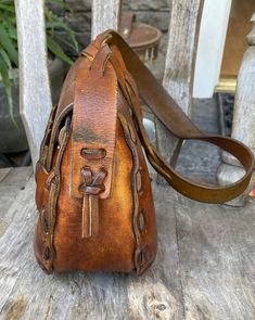 Vintage Brown Bohemian Rectangular Bag, Vintage Brown Handmade Hobo Bag, Vintage Handmade Brown Hobo Bag, Vintage Leather-lined Hobo Satchel Bag, Vintage Leather Hobo Bag With Adjustable Strap, Hippie Brown Leather Bag, Bohemian Brown Satchel With Leather Lining, Vintage Brown Vegetable-tanned Shoulder Bag, Vintage Vegetable-tanned Shoulder Bag For Daily Use