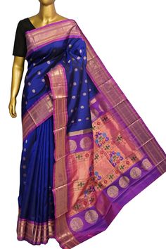 Transform your saree collection with the latest addition featuring intricate golden zari butta work in a charming chand (moon) motif, complemented by exquisite Mor or peacock motif designs on the pallu. Elevate your style with this timeless handloom masterpiece! Color: A shade of navy blue color Technique: Amazing work of golden butta work on the body with traditional paithani design weaving on the pallu Fabric: Paithani Silk Quality: Indyvogue's Assurance of Pure Silk Mark Certified Saree Maharani Paithani, Peacock Motif, Paithani Saree, Color Techniques, Work Sarees, Motif Design, Navy Blue Color, Saree Collection, Blouse Piece