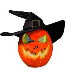 a pumpkin with a witch hat on it