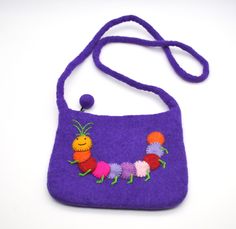 This little bag is utterly adorable!    Your little one will have the only one like it, and it's made so well it will last for years.  The body of the bag and strap is made with thick felted wool and features a colouful caterpillar.  There is a secure zip across the top, and the bag measures 20cm wide, 16cm high, and the strap is 55cm long. A unique & charming gift for any child! Long A, Felted Wool, Charm Gift, Caterpillar, Wool Felt, Purses And Handbags, Little One, 20 Cm, Shoulder Bags