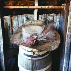 Burned straw cowboy hat with rose and feather embellishments. Detavhable hat fascinator feather hat piece with rose and and feathers. saying is "She Blooms Where She's Planted" Dried Flowers Hat Band, Country Style Top Hat For Kentucky Derby, Rustic Straw Hat For Rodeo At Kentucky Derby, Western Hat Bands For Wedding And Kentucky Derby, Feather Trim Hat For Rodeo And Kentucky Derby, Feather Trimmed Hat For Rodeo And Kentucky Derby, Bohemian Straw Hat For Kentucky Derby Country Events, Western Mini Hat With Feathers For Rodeo, Western Mini Hat With Feathers For Country Events