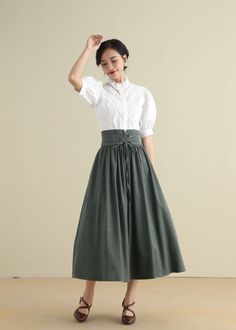 "DETAIL * 50% linen, 50% cotton * No lining * Pleated around waist * Two side seam pockets * Front drawstring skirt * Back zipper closure * Mid calf length * Perfect for spring and summer, autumn * Wash by hand or machine with cold water * The model is 170cm (5′7″) tall with a 80cm (31.5\") bust, 66cm (26\") waist. She is wearing the green skirt in size XS * Choose CUSTOM Order if you Can't find your size in our size Chart Chang the Length Your Height is not Between 5'1\" - 5\"9\" Your weight is High Waist Gathered Cotton Skirt, High Waist Cotton Gathered Skirt, High Waist Cotton Gathered Maxi Skirt, Spring Waist-length Skirt With Pleated Waist, Pleated Linen Long Skirt, Green Linen Skirt, Linen Skirt Midi, A Line Skirt Midi, Long Linen Skirt