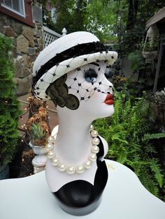 LOVELY Classy Vtg 1940's Ladies White & Black Velvet Ribbon Woven Veiled Bumper Hat sz 21" DiameterThis is such a fun vintage Bumper hat from the 1940's.  It's in just impeccable condition with no flaws I could note what so ever.  The hat is a bright white woven fabric which feel synthetic to me.  It has a short little brim which tilts up slightly at the sides with a gorgeous black veil attached to the front of the hat. There's a beautiful black velvet ribbon round the crown of the hat with a sl Fitted Vintage Cloche Hat For Vintage Events, Vintage Fitted Mini Hat With Flat Brim, Fitted Vintage Black Hat Bands, Retro Wide Brim Mini Hat, Vintage Mini Hats With Fitted Short Brim, Vintage Brimmed Cloche Hat One Size, Vintage Mini Hats With Short Brim, Vintage Mini Hat With Short Brim, Vintage Brimmed Cloche Hat