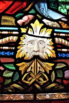 a stained glass window with an image of a man's face