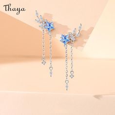 Our Starry Fringe Earrings are inspired by the twinkling night sky and the fluidity of movement. Each earring is delicately crafted with shimmering metal fringe that gracefully sways and catches the light like stars dancing in the sky. Make a statement with these celestial-inspired earrings that add a touch of ethereal beauty to any outfit.   - Brand: Thaya  - Material: S925 Silver Synthetic Cubic Zirconia   - Weight: 2.18g (total weight)   - Size: Height 37.6mm, width 14.85mm  - Gender: Women Dancing In The Sky, Kawaii Design, Special Jewelry, Ethereal Beauty, Fringe Earrings, Twinkle Twinkle, Night Sky, Night Skies, Sales Gifts