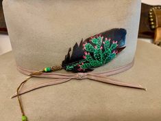 New Cactus are blooming here at hickerbilly Art, HAT FEATHER, custom retro hat accessories, cowgirl hat feather, boho western, hippie hat, equipped with a beaded sinew wind tie for securing to your hat.  HAT NOT INCLUDED Ships FREE in USA