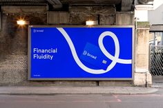 a blue sign that says financial fluidity on the side of a building next to a street