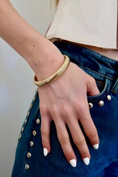 Elevate any outfit with our chic Snake Stretch Bracelet. Made with 10KT dipped brass, it effortlessly adds a touch of fun and sophistication to your look. The flexible design ensures a comfortable fit, making it the perfect accessory for any occasion. Brass dipped in 10K Gold 2.25" Inner Diameter Weight 18.87g Flexible Design, Stretch Bracelet, 10k Gold, Stretch Bracelets, Gold Bracelet, Comfort Fit, Brass, Bracelet, Gold