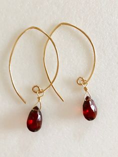 "Stunning rich red Luxe AAA Mozambique garnet earrings in 14k gold fill or Sterling silver. Beautiful 10/11x 7mm faceted rich burgundy red garnet pear briolettes wire wrapped on handmade 14k gold fill ear wires. These garnets are a gorgeous red color, clear and translucent. Total drop length is 1 3/4\"." Gold Garnet Earrings As Gift, Yellow Gold Garnet Earrings For Gift, Gold Garnet Teardrop Earrings, Gold Teardrop Garnet Earrings, Red Garnet Wire Wrapped Earrings, Elegant Red 14k Gold Filled Earrings, Elegant Red 14k Gold-filled Earrings, Gold Garnet Dangle Earrings, Red Garnet Earrings