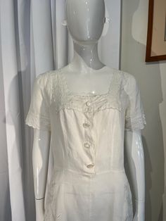 Sweet vintage Ralph Lauren white linen antique style dress with lovely floral embroidered detail. This impeccably made dress features a set of pearlized white buttons that are secured with hook & eye closures between each one.  Measurements: Bust 34" Waist 29" Shoulder 7 3/4" Sleeve length 8 1/4" Hips 42" 38" length from nape to hem Summer Wedding Dress With Button Closure, Vintage Linen Dress With Square Neck, Elegant Vintage Spring Dress With Buttons, Elegant Vintage Dress With Buttons For Spring, White Spring Dresses With Pearl Buttons, Elegant Linen Dresses With Broderie Anglaise, Classic Vintage Dress With Buttons For Spring, Vintage Summer Dresses With Covered Buttons, Vintage Summer Dress With Buttons For Garden Party