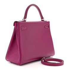 This is the authentic HERMES Epsom Candy Kelly Retourne 32 in Tosca and in Rose Tyrien. This stylish Kelly handbag is crafted of luxurious grained calfskin leather in purple. This bag features a rolled leather top handle, an optional shoulder strap, and a cross-over flap with a strap closure and polished palladium turn-lock. This opens to a bright pink leather interior with zipper and patch pockets. Kelly Handbag, Pink Leather, Leather Interior, Leather Top, Bright Pink, Patch Pocket, Top Handle, Calf Skin, Shoulder Strap