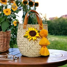 Each bag is handcrafted with care and attention to detail by skilled artisans using traditional techniques.  These all-natural baskets are made from palm leaves, and and dyed with beautiful traditional designs. Since each basket is handmade.  The addition of genuine leather straps adds durabilit. Pompom included Bohemian Palm Leaf Straw Bag With Leather Handles, Artisan Bucket Bag With Braided Handles In Natural Color, Artisan Natural Bucket Bag With Braided Handles, Artisan Straw Bucket Bag With Leather Handles, Bohemian Straw Bag With Leather Handles, Eco-friendly Handmade Natural Fiber Bucket Bag, Yellow Handwoven Bucket Straw Bag, Handmade Natural Fiber Bucket Bag, Handmade Natural Fiber Bucket Bag For Market