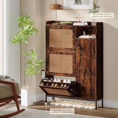 a wooden cabinet with shoes on it in a living room