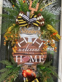 a football wreath is hanging on the front door to welcome you into your home and family