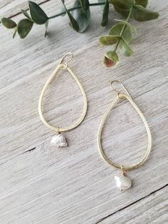 "Beautiful gold teardrop hoop earrings are paired with keshi freshwater pearls, they hang from gold filled ear wires. Earrings measure 2.50\" from top of ear wire to bottom of pearl. All your items will be packaged and shipped in a cotton filled kraft box. ~The best way to prevent tarnish is to wear your jewelry regularly. When not wearing your jewelry, the best way to protect it is to store it in a sealed plastic bag. Humidity, chemicals and chlorine can dramatically speed up the tarnishing pro Pearl Teardrop Hoop Earrings With Pearl Drop, Everyday Handmade Teardrop Pearl Earrings, Pearl Teardrop Hoop Earrings For Gift, Pearl Teardrop Hoop Earrings As Gift, Teardrop Pearl Hoop Earrings For Gifts, Teardrop Pearl Charm Earrings For Anniversary, Gold Teardrop Pearl Drop Earrings For Everyday, Everyday Teardrop Pearl Drop Earrings, Everyday Gold Teardrop Pearl Drop Earrings