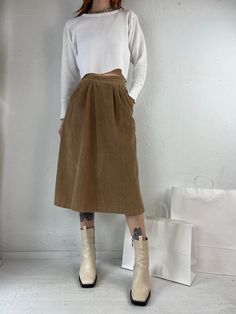 "- Vintage 70s brown corduroy midi skirt  - Made in Canada - Zipper and button closure - Pockets - Tagged 6  Waist: 24\" Length: 28.5\"" High-waisted Brown Corduroy Skirt, Corduroy Skirt For Fall Workwear, Fall Corduroy Skirt For Workwear, Fall Corduroy Skirt With Pockets, High Waist Corduroy Skirt For Fall, High-waist Corduroy Skirt For Fall, Spring Corduroy Skirt With Pockets, Corduroy Skirt With Pockets For Work, Vintage Corduroy Skirt For Fall