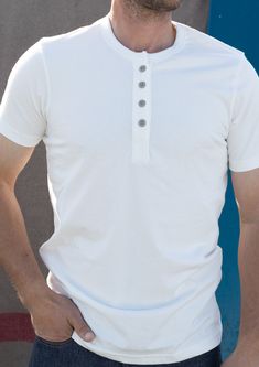 All-day, every day step it up from a tee shirt, shirt! The Reyes four button Henley will keep you looking sharp. Soft, durable & effortlessly looks great no matter how you style it. At 8oz this is no lightweight. Double stitched seams for vintage, timeless quality. True to size with a tailored shoulder and arm and a bit of extra length in the body. Wear your normal size for a tailored fit or you can size up for a more relaxed fit. We knit this shirt to have a bit more weight and structure to imp Relaxed Fit Button T-shirt For Everyday, White T-shirt With Buttons Relaxed Fit, White Relaxed Fit T-shirt With Buttons, White Cotton Henley With Buttons, Cotton T-shirt With Buttons For Everyday, Everyday Cotton T-shirt With Buttons, Everyday Relaxed Fit T-shirt With Buttons, White Crew Neck T-shirt With Buttons, Classic Henley Neckline T-shirt For Everyday