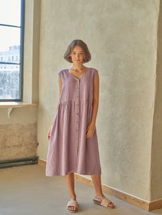 "PRODUCED in 3-5 days FAST & FREE shipping with DHL Express Courier -10% for all items with code \"FAVOURITE\" Made from pre-washed soft linen in a subtle lavender color with a light purple hue, this dress is for your natural charm. A v-neck, slightly emphasized waist and buttons at the front will make your outfit romantic and comfortable.  Details: - 100% Linen - Pure linen fabric - V neck - Flared silhouette  - Slightly emphasized waist - Two side pockets - Buttoned front - Above knee length - Comfortable fit - Model's height is 160 cm / 5'3'' wears size M - Code: E9021-L532-125 The dress is available in other colors. You can find them in the gallery. If you want to order the dress in another color, please specify it in the personalization field. Sizing: This garment is true to size, and Summer Purple Dresses With Pockets, Casual Lavender Knee-length Midi Dress, Casual Purple Midi Dress For Daywear, Casual Lavender Sleeveless Dress, Lavender Sleeveless Day Dress, Casual Lavender Midi Dress For Daywear, Lavender Sleeveless Dress For Daywear, Lavender Midi Dress For Daywear, Mauve Knee-length Midi Dress For Summer