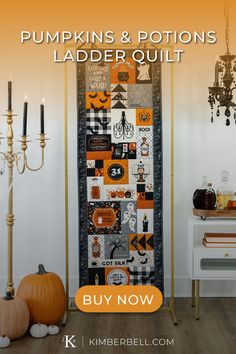 the pumpkins and potions ladder quilt is on display