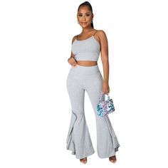 Spaghetti Strap Crop Top+ruffles Flared Pants Set Casual Ruffled Pants For Loungewear, Casual Solid Color Pants With Ruffles, Trendy Ruffled Stretch Pants, Trendy Stretch Pants With Ruffles, Trendy Ruffled Pants, Casual Ruffled Flare Bottoms, Casual Flare Bottoms With Ruffles, Spring Loungewear Pants With Ruffles, Trendy High Waist Ruffled Pants