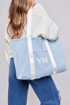 This essential carryall tote bag is just what you need this season! Crafted from denim for a stylish, yet durable bag. We’ve also designed these with colored nylon straps for a unique and fun look. Made with re-enforced stitching at the base of handles to endure wear and tear. Featuring a functional large front pocket for convenience. This bag is perfect for effortless wear on arms or shoulders. Dimensions Horizontal Tote:Height: 35 cmWidth: 49 cmDepth: 8.5 cm Handle Length: 32 cm Dimensions Ver Cheap Turquoise Tote Bag, Casual Shoulder Bag With Pockets For Weekend, Casual Weekend Shoulder Bag With Pockets, Casual Cotton Canvas Bag For Weekend, Cotton Weekend Bag With Pockets, Weekend Cotton Bag With Pockets, Weekend Cotton Bags With Pockets, Casual Weekend Bag For Spring, Trendy Everyday Denim Blue Canvas Bag