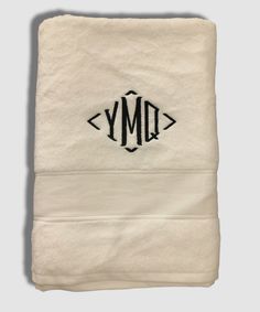 an embroidered monogrammed towel with the letter ym on it