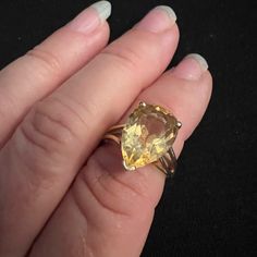 10k Yellow Gold 5.40 Carat Pear Cut Citrine Ring Vintage 1960’s, Solitaire Statement Ring This Is A Huge Statement Stone! The Center Synthetic Pear Shape Orange Citrine Measures 15.20 X 9.93 Mm. This Ring In A Bypass Design Mounting, Is A Size 7.0 And Weighs 3.40 Grams. This Vintage 10k Yellow Gold Pear Shape Orange Citrine Solitaire Cocktail Ring Would Make The Perfect Gift Or Addition Towards Anyone's Collection. Slightly Out Of Round, Needs Reshaping. Classic Orange Gemstone Jewelry, Classic 14k Gold Orange Jewelry, Classic Orange 14k Gold Jewelry, Orange Pear-shaped Jewelry, Classic Teardrop Citrine Jewelry, Classic Orange Jewelry With Prong Setting, Orange Teardrop Jewelry For Formal Occasions, Classic Citrine Jewelry, Heirloom Orange Jewelry For Formal Occasions