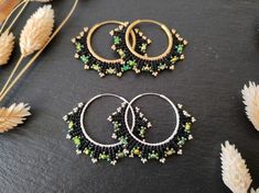 Elegant handwoven hoops with fire-polished Czech beads and Miyuki Delica Option 1 : Black/green & brass Option 2 : Black/green & sterling silver These beaded hoop earrings were designed to match the Coburn bracelets - both the hoop earrings and the bracelet are available as a jewelry set in my shop. I used a number of high-quality seed beads and fire-polished glass beads of well-known glass bead manufacturers for this design. The filled herringbone stitch was woven with resilien beading thread s Handmade Adjustable Green Hoop Earrings, Adjustable Handmade Green Hoop Earrings, Handmade Green Hoop Earrings For Gift, Handmade Green Beaded Hoop Earrings, Handmade Black Hoop Jewelry, Festival Green Hoop Earrings, Green Hoop Earrings For Festivals, Handmade Black Beaded Small Hoop Earrings, Handmade Small Green Hoop Earrings