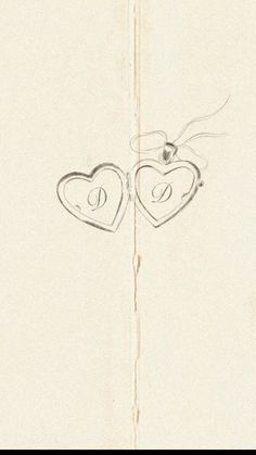 two hearts are drawn in the middle of a piece of paper with writing on it