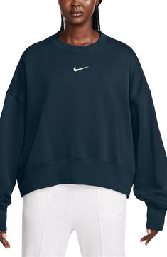 An embroidered Swoosh adds minimal branding to this cozy fleece sweatshirt cut for a relaxed, oversized fit that's enhanced by the dropped shoulders. 22" length (size Medium) Crewneck 80% cotton, 20% polyester Machine wash, tumble dry Imported Navy Blue Nike Crewneck, Navy Nike Sweatshirt, Blue Nike Crewneck, Nike Phoenix Fleece, Nike Crew Neck, Navy Blue Sweatshirt, Nike Crewneck, Minimal Branding, Cut Sweatshirts