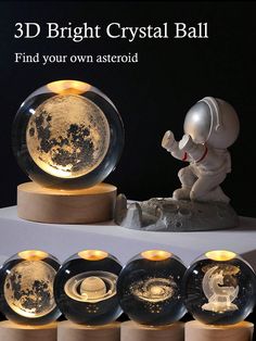 an image of a set of three crystal balls with astronaut figures inside them on display