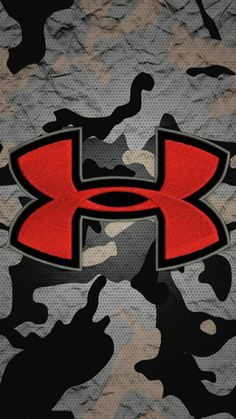 the under armour logo is on top of camouflage camo print fabric with black and red accents