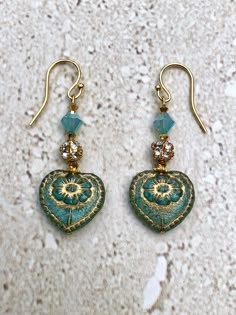 Heart Earrings featuring a 17MM aqua czech glass heart bead with gold inlay accented with 3MM crystals, a 6MM rhinestone bead and a 6MM Pacific Opal A/B Swarovski crystal.  Gold Filled Earwires. Handmade. GIFT BOXED Earrings Glass Beads, Czech Glass Beads Jewelry, Czech Beads Jewelry, Glass Bead Jewelry, Czech Glass Jewelry, Hippie Earrings, Earrings Heart, Summer Earrings, Dope Jewelry