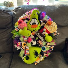 a pile of stuffed animals sitting on top of a couch