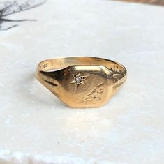 A vintage 9 carat gold signet ring with a set diamond. This charming piece has a great shape and a small amount of detailing on either side down the shoulders.CONDITION: Wear consistent with age and use. Please see photos for more detail.ASSAYED IN BIRMINGHAM, MADE CIRCA.1986APPROX. BAND WIDTH: 3mmAPPROX. FACE SIZE: 10mm x 12mmRING SIZE: UK: V 1/2 | US: 11WEIGHT: 3.7g(HZ) White Sapphire Ring, Gold Signet Ring, Jewelry Style, Enamel Ring, Ring Photos, White Sapphire, Unique Engagement Rings, Signet Ring, Chain Bracelet