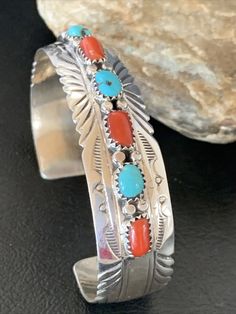 Masha Indian Native American Jewelry   -On Route 66 -         Albuquerque, New Mexico U.S.A   Item Specifics Regional Style: Native American Stone: Kingman Turquoise & Coral Size: 6.25" Gap: 1.10" Top Measurement: 0.5" Color: Blue & Red Tribal Affiliation: Navajo Artisan: S Metal: Sterling Silver Purity: 925 Made in USA SKU: 12315 Genuine Sterling Silver Jewelry  This beautiful Bracelet is made from all 925 Sterling Silver. These pieces are painstakingly handmade by the artist creating the perfe Native American Jewelry Diy, Antique Turquoise Jewelry, Navajo Silver Jewelry, Vintage Turquoise Jewelry, Jewlery Rings, Nashville Outfit, Antique Turquoise, Turquoise Jewelry Native American, American Indian Jewelry