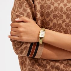 Inspired by the sleek designs of 1920s Art Deco the Cadie watch has an elegant long and lean silhouette. The gold tone bracelet timepiece features a dial detailed with our iconic Horse and Carriage motif. | Coach Cadie Watch, 20 Mm X 32.5 Mm - Women's - Gold Coach Watches Women, Coach Watch, Horse And Carriage, 1920s Art, Large Wallet, 1920s Art Deco, New Handbags, Belt Bag, Time Piece