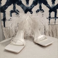 Perfect For The Fun Festive Bride Or Anyone Who Needs Some Fun White Shoes! Zip Up At Heel, Feathered Detail Around Ankle Square Toe. Satin Material, Small Block Heel About 3 Inches Or So. Never Worn Only Tried On, Ordered Og On Line. $25 Obo Feathered Open Toe Sandals For Party, Feathered Heels With Round Toe For Summer, Party Sandals With Feathers And Open Toe, Summer Heels With Feather Trim And Round Toe, Summer High Heel Feathers Heels, Summer High Heels With Feathers, Summer Party Sandals With Feather Trim, Summer Evening Heels With Feathers, Feathered High Heels For Summer