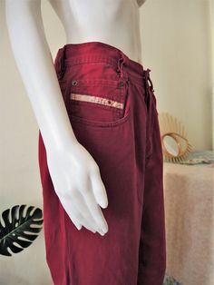 Vintage Diesel jeans from the 1990s in an amazing wine red shade! Mid rise relaxed fit, soft cotton denim fabric. Classic five pocket style. Button fly. Diesel brand label on the right pocket. Tapered legs. Unisex. Made in Italy! Pair them with a 90s crop top or tuck in a t-shirt. BRAND: Diesel ERA: 1990s COLOR: Wine red FABRIC: 100% cotton SIZE: Waist 32 - please check the measurements below as Diesel jeans are not always true to size! MEASUREMENTS: Waist 39cm, rise 33cm, inner leg 70cm, total Casual Burgundy Straight Leg Jeans, Burgundy Straight Leg Cotton Jeans, Burgundy Cotton Straight Leg Jeans, Burgundy Straight Leg Cotton Bottoms, Burgundy Cotton Straight Leg Bottoms, 90s Red Straight Leg Jeans, 90s Style Red Cotton Jeans, 90s Crop Top, Diesel Brand