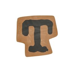 a piece of cardboard with the letter t painted on it