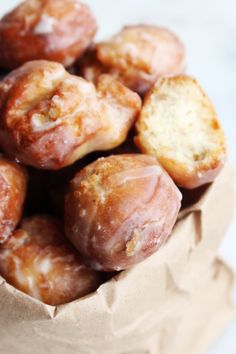 some doughnuts are sitting in a paper bag