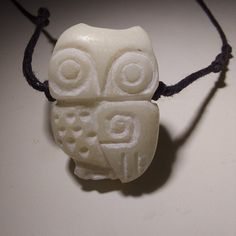 Owl Necklace is a unique stone carved necklace. Owl pendant is hand carved by Timucin Cakaloz. White Beach Stone from Aegean Sea. Adjustable Carved Amulet Style Necklaces, Symbolic Carved Necklace For Gifts, Adjustable Carved Spiritual Necklace, Carved Amulet Pendant Necklace, Carved Pendant Necklace Amulet Style, Carved Pendant Amulet Necklace, Carved Pendant Necklace Adjustable, Artisan Carved Necklaces As A Gift, White Carved Pendant Necklaces