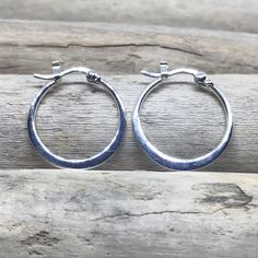 "The perfect everyday accessory, these glistening hoop earrings are made from 925 Sterling Silver. if you want something not too small or not too big, this is perfect for you! These hoops are 0.78\" (20mm) in length and width. SOLD AS A PAIR For more Silver Earrings: http://etsy.me/2AJWHDP ENTER MY SHOP HERE: KalismaBijoux.etsy.com HANDMADE by ME - All my work is crafted with the utmost care in my studios - in Madrid, SPAIN CHANGES Don't hesitate to contact me if you have an idea or request. ABO Small Silver Oxidized Hoop Earrings, Small Silver Hoop Earrings Hallmarked, Sterling Silver Round Hallmarked Hoop Earrings, Silver Tarnish-resistant Sterling Silver Hoop Earrings, Silver-plated Cubic Zirconia Hoop Earrings, Peace Earrings, Bali Earrings, Simple Hoop Earrings, Hoop Earrings Silver