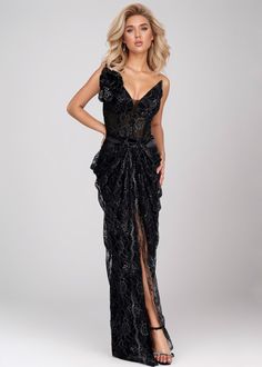 Expertly crafted, the "Veronica" dress features a classic V-neck design and a stunning black floral lace material that is both elegant and feminine. Adding a touch of glamour, the 3D flower decoration and draped maxi length make this dress a must-have for any special occasion. Fabric: Non-Stretch Material: Polyester Fiber Elegant Lace Evening Dress With Ruffles, Elegant Lace V-neck Maxi Dress, Elegant V-neck Lace Maxi Dress, Floor-length Lace Evening Dress For Gala, Elegant Black Lace Maxi Dress, Glamorous Maxi Lace Evening Dress, Elegant Black Lace Gown, Black Lace V-neck Evening Dress, Glamorous Floor-length Lace Maxi Dress