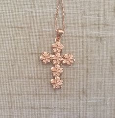 Solid .925 Large Sterling Silver with Rose Gold overlay Hawaiian 3-D Cross Plumeria Necklace. The size is 32x22MM plus the 7MM bail. Just stunning in person, it is designed to mimic the look of fine jewelry at a fraction of the cost. FREE Italian Sterling Silver Rose box chain included. The cross features six 8MM Plumerias with Sandblasted Matte centers and High-Polished shiny edges. --The Plumeria is iconic of Hawaiian culture. It's bright colors and magnificent scent greet both visitors and lo Rose Gold Jewelry With Hallmark For Gift, Rose Gold Jewelry Gift With Hallmark, Rose Gold Cross Jewelry For Mother's Day, Rose Gold Cross Pendant Necklace For Gift, Rose Gold Cross Necklace For Gift, Engraved Rose Gold Cross Jewelry, Rose Gold Jewelry With Rose Design For Anniversary Gift, Rose Gold Flower Shaped Jewelry Gift For Mom, Rose Gold Flower Shaped Jewelry For Mom