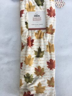 an oven mitt covered in autumn leaves