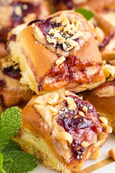 A tray of freshly baked Peanut Butter and Jelly Hawaiian Roll Cheese Danish topped with peanuts. Cream Cheese And Peanut Butter, Cream Cheese Peanut Butter, Cheese Danish Recipe, Hawaiian Roll, Danish Recipe, Scrumptious Food, Delicious Soups, Cheese Danish, Dinner Rolls Recipe