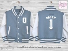 Looking for the perfect personalised custom kids varsity jacket? This supersoft, college baseball children's varsity jacket is the ultimate blend of style and comfort. With its letterman style design, it's a must-have for kids, toddlers and babies alike.  Featuring a name on the back and initial on the front, our jacket allows you to add a personal touch that your child will love. It's the ideal birthday, new baby, christening, or Christmas gift. Plus, with the option to match siblings, you can School White Cotton Varsity Jacket, White Cotton Varsity Jacket For School, School Varsity Jacket With Ribbed Cuffs, White Varsity Jacket With Letter Patch And Baseball Collar, White Varsity Jacket With Ribbed Cuffs For Game Day, Sporty Cotton Varsity Jacket For School, College Style Varsity Jacket With Baseball Collar, White Varsity Jacket With Ribbed Cuffs For School, White Varsity Jacket With Baseball Collar For School